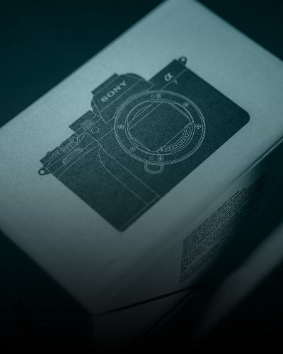 Sony camera on a product box with a dark background