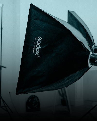Godox studio light modifier with logo on a blurred background