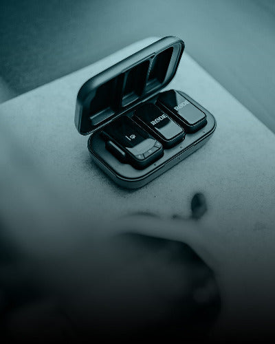 Black electronic device with buttons on a gray surface
