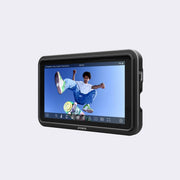 Display device with a screen showing a person on a skateboard, branded 'Atomos', on a light gray background