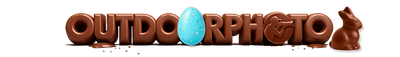 Chocolate-themed Outdoorphoto logo with a blue egg and chocolate bunny on a white background