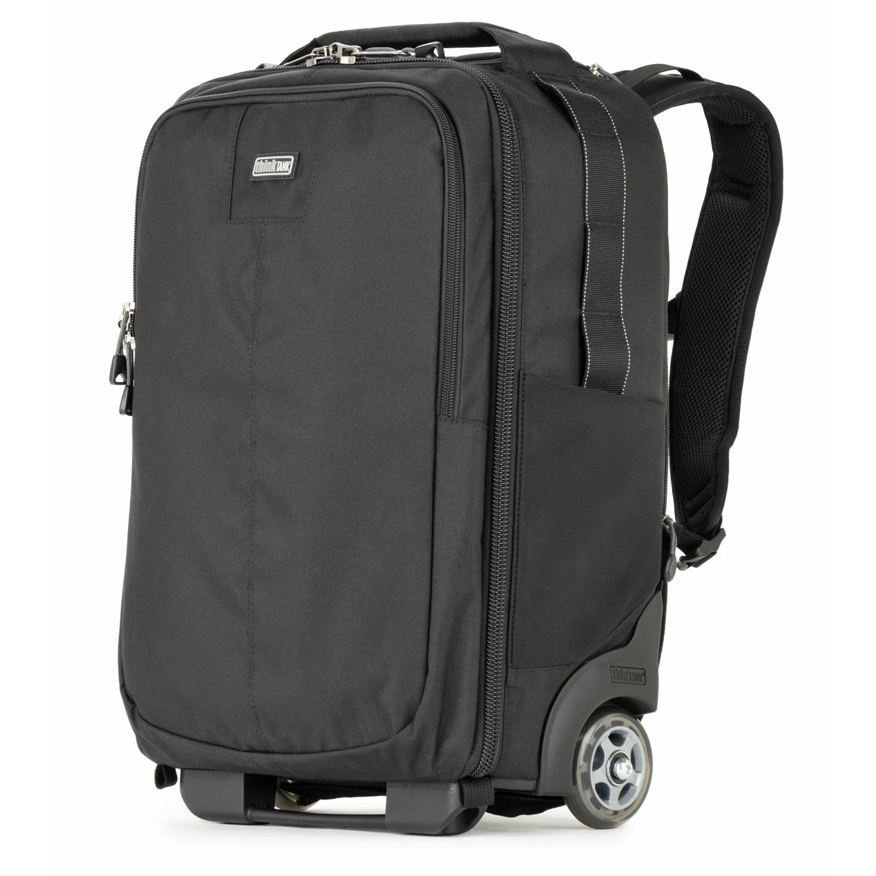 Think Tank Essentials Convertible Rolling Backpack — black, compact carry‑on camera bag with retractable handle, stowable backpack straps, and tripod mounting system