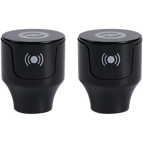 Two black car cup holders with wireless charging symbols on a white background
