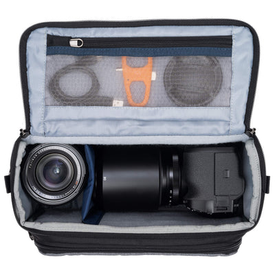 Think Tank Photo Mirrorless Mover 25 camera shoulder bag, black, compact with flip-top lid, multiple pockets, padded interior for mirrorless camera and lenses, rain cover included