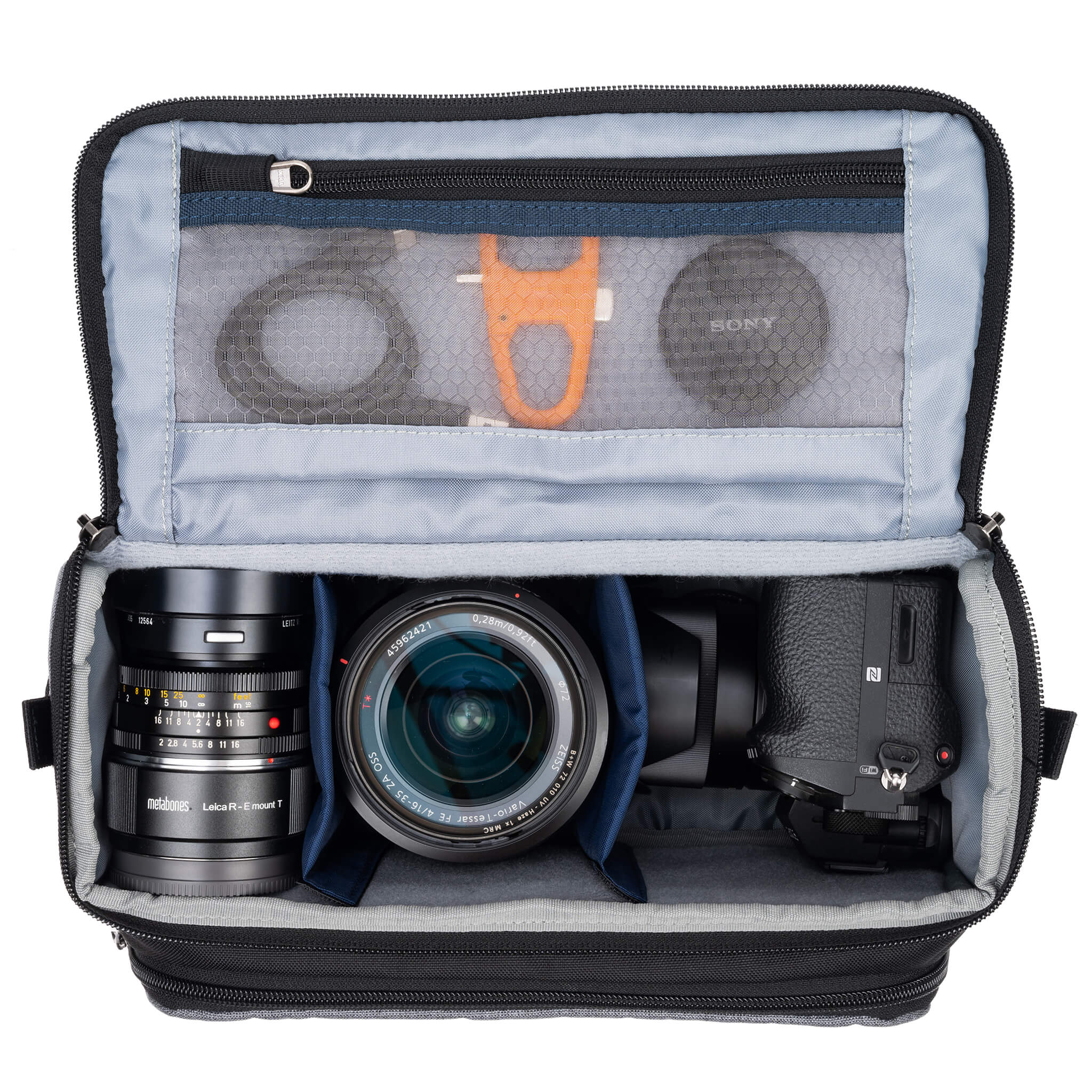 Think Tank Photo Mirrorless Mover 25 camera shoulder bag, black, compact with flip-top lid, multiple pockets, padded interior for mirrorless camera and lenses, rain cover included