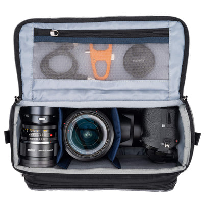 Think Tank Photo Mirrorless Mover 25 camera shoulder bag, black, compact with flip-top lid, multiple pockets, padded interior for mirrorless camera and lenses, rain cover included