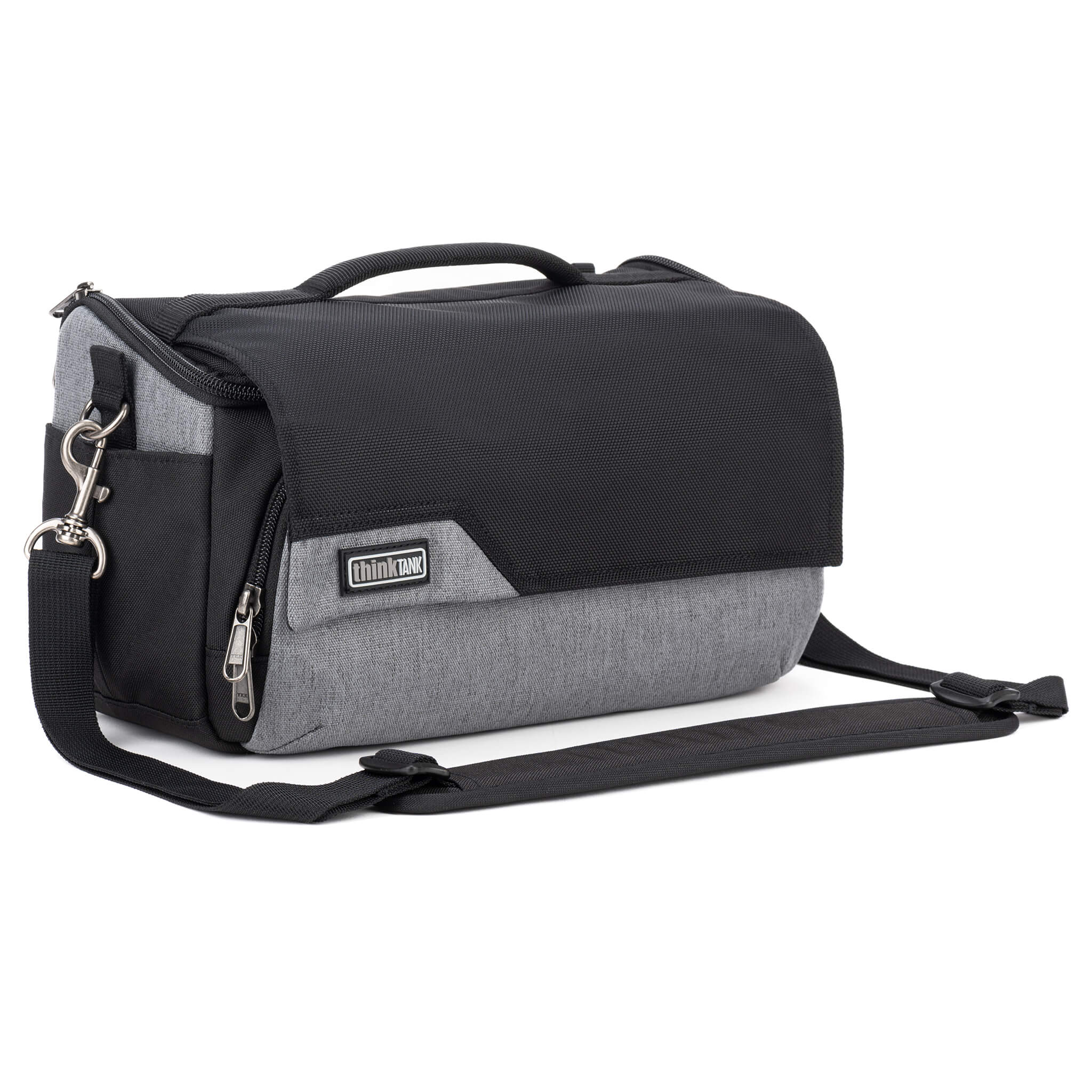 Think Tank Photo Mirrorless Mover 25 camera shoulder bag, black, compact with flip-top lid, multiple pockets, padded interior for mirrorless camera and lenses, rain cover included