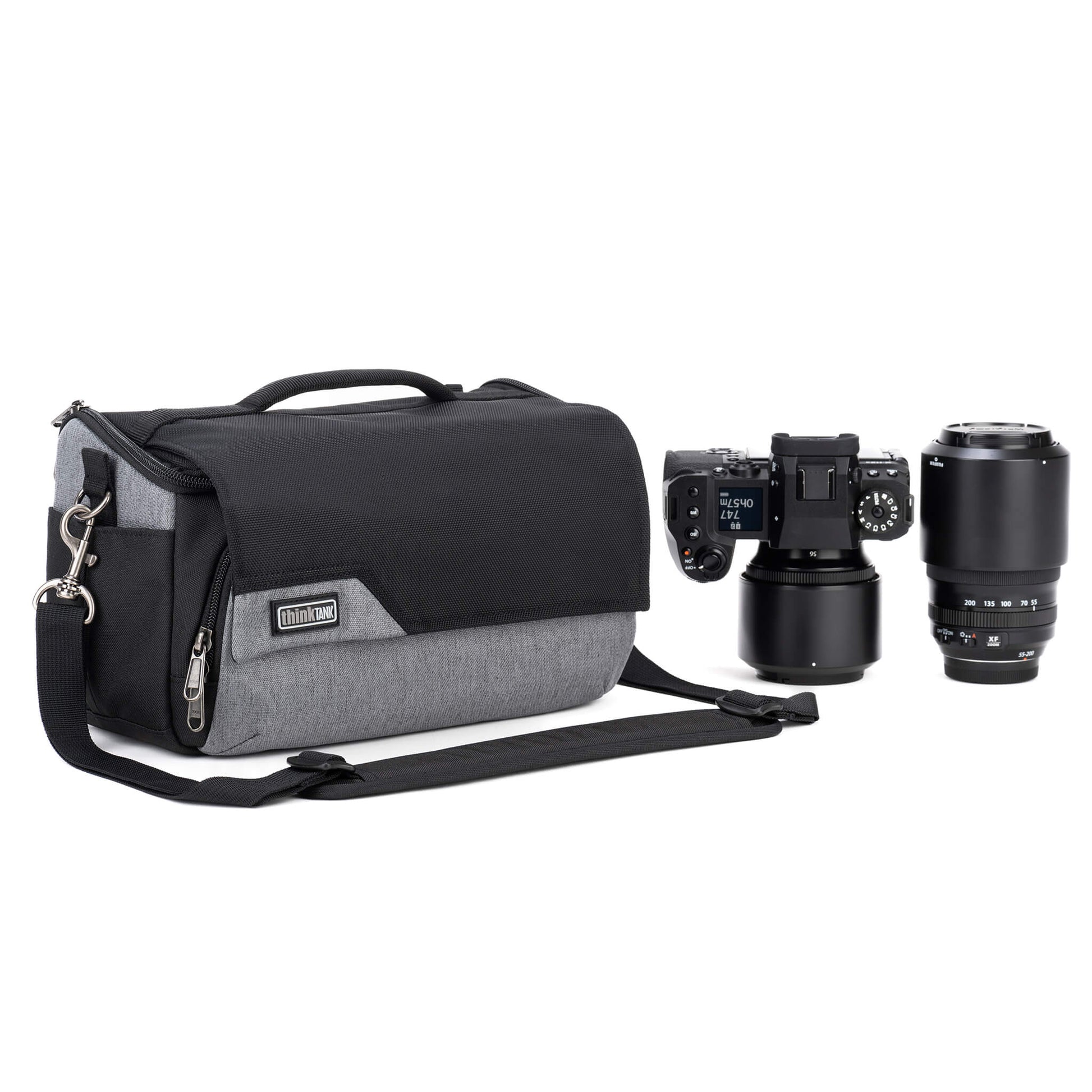 Think Tank Photo Mirrorless Mover 25 camera shoulder bag, black, compact with flip-top lid, multiple pockets, padded interior for mirrorless camera and lenses, rain cover included