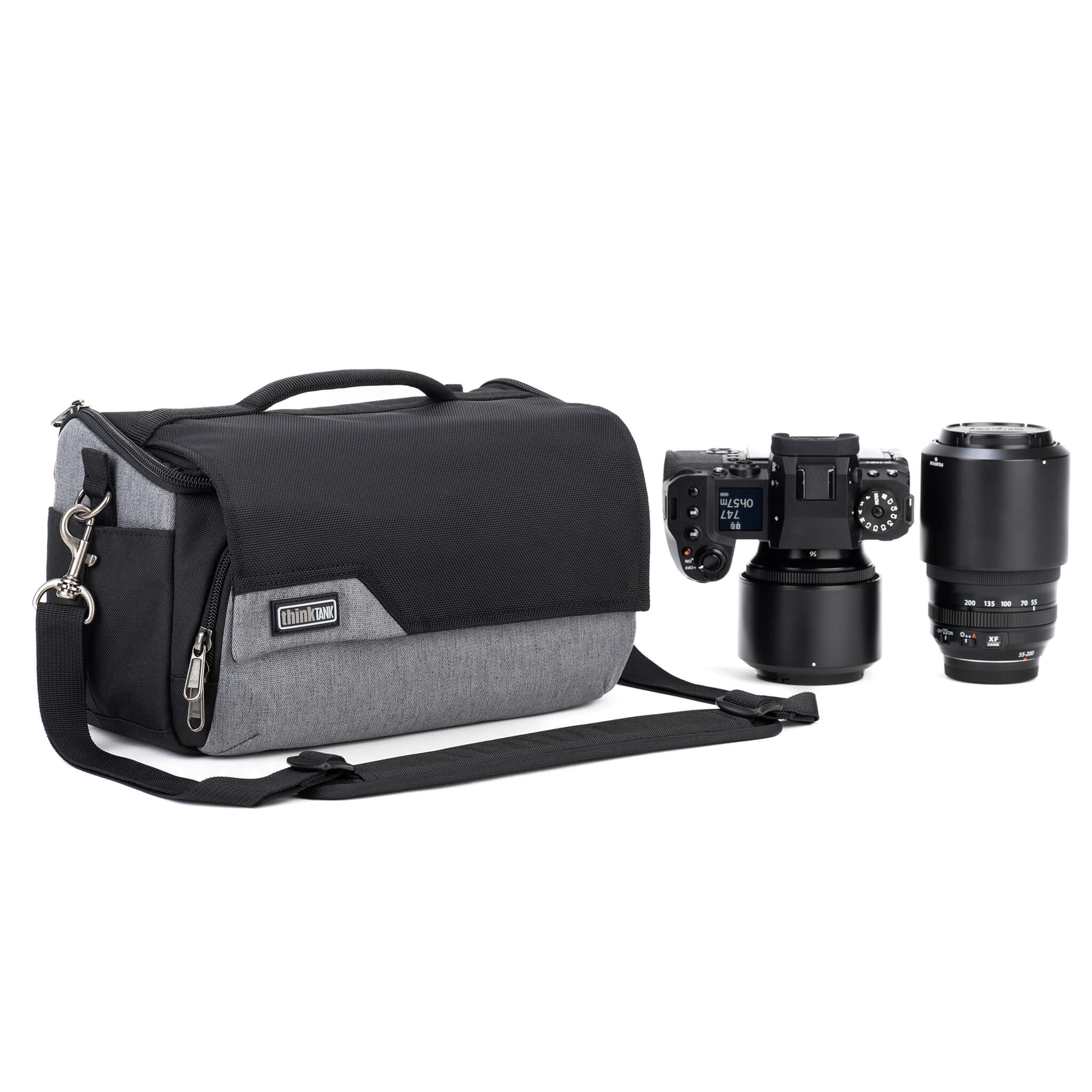 Think Tank Photo Mirrorless Mover 25 camera shoulder bag, black, compact with flip-top lid, multiple pockets, padded interior for mirrorless camera and lenses, rain cover included