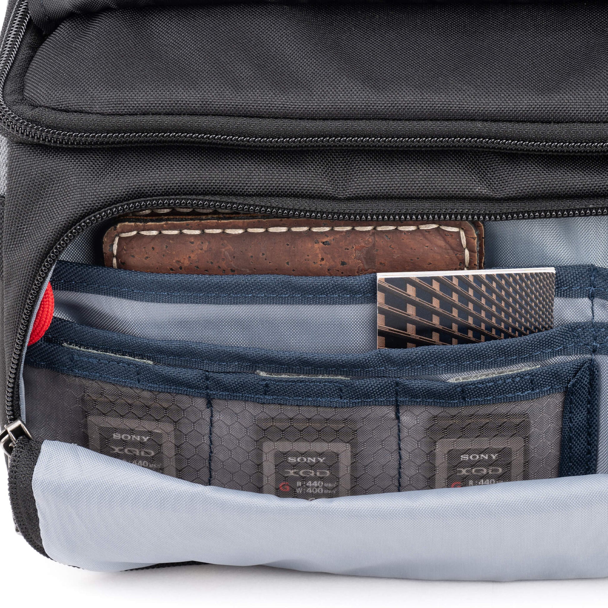 Think Tank Photo Mirrorless Mover 25 camera shoulder bag, black, compact with flip-top lid, multiple pockets, padded interior for mirrorless camera and lenses, rain cover included