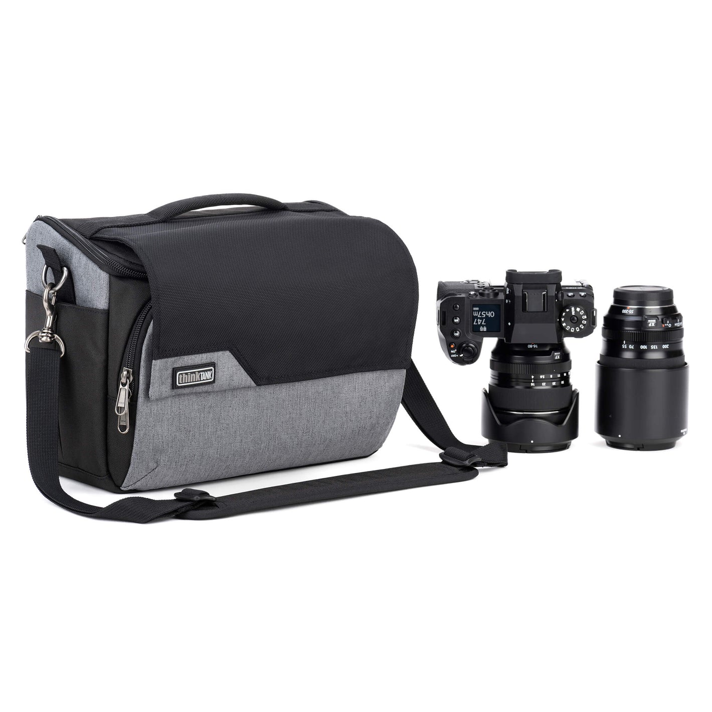 Think Tank Photo Mirrorless Mover 30 camera shoulder bag, flip-top lid with magnetic closure, multiple pockets, padded interior with adjustable dividers for mirrorless camera and lenses, rain cover included