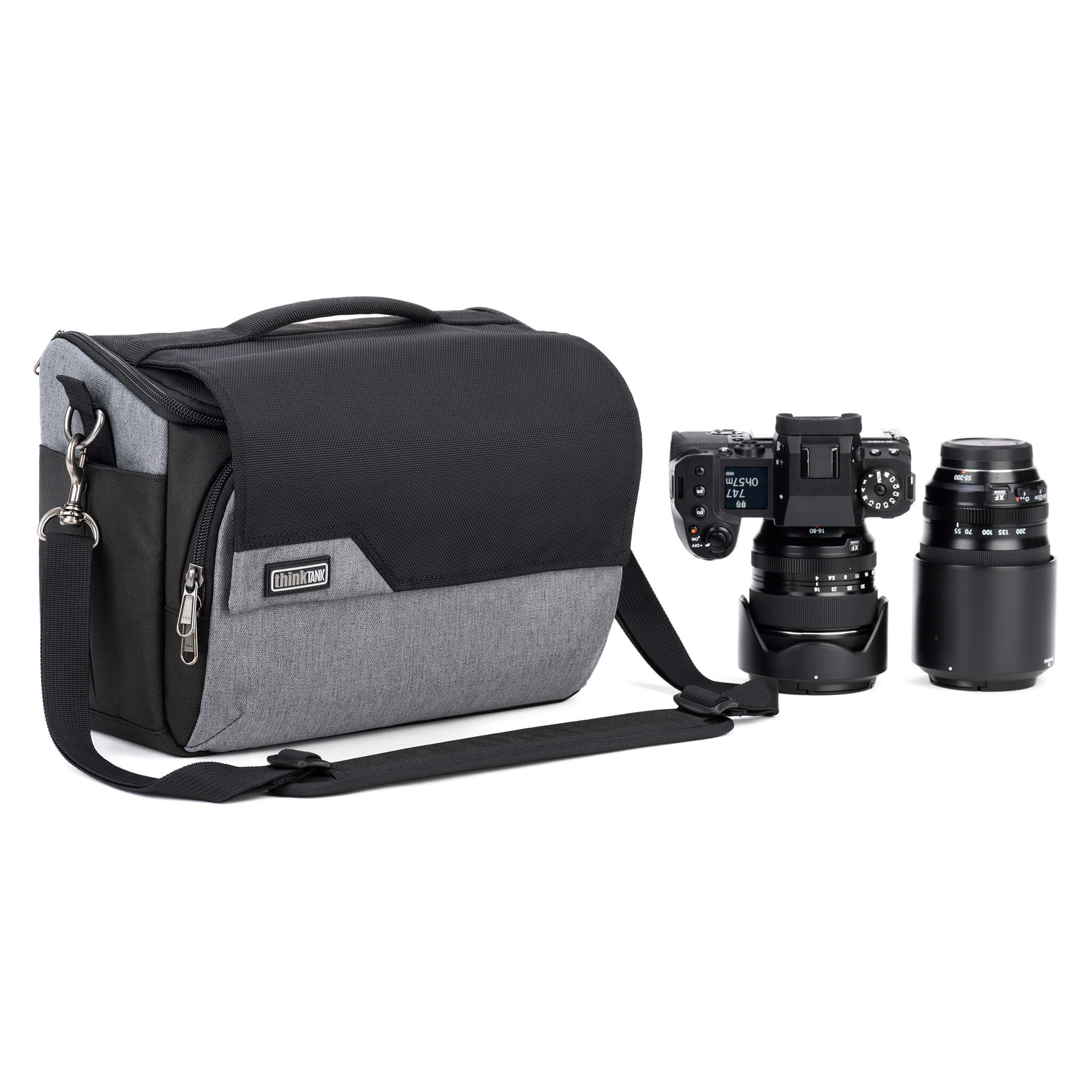 Think Tank Photo Mirrorless Mover 30 camera shoulder bag, flip-top lid with magnetic closure, multiple pockets, padded interior with adjustable dividers for mirrorless camera and lenses, rain cover included