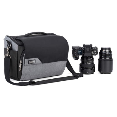 Think Tank Photo Mirrorless Mover 30 camera shoulder bag, flip-top lid with magnetic closure, multiple pockets, padded interior with adjustable dividers for mirrorless camera and lenses, rain cover included