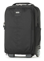 Think Tank Essentials Convertible Rolling Backpack — black, compact carry‑on camera bag with retractable handle, stowable backpack straps, and tripod mounting system