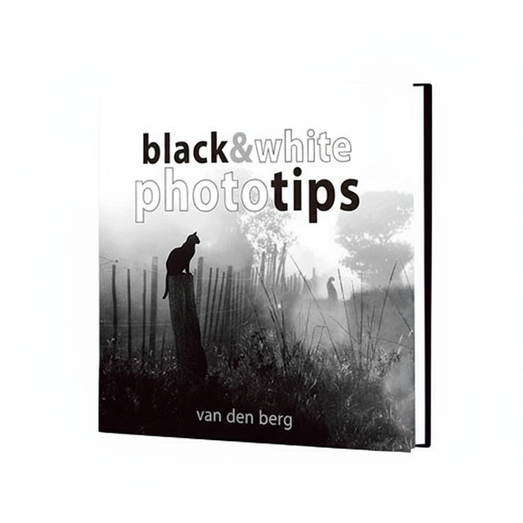 Book cover of Black & White Phototips by Heinrich van den Berg, a guide for black and white photography.