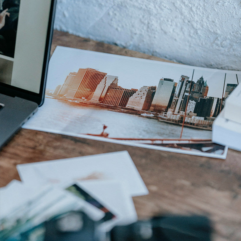 Cityscape print on a wooden surface with a blurred background