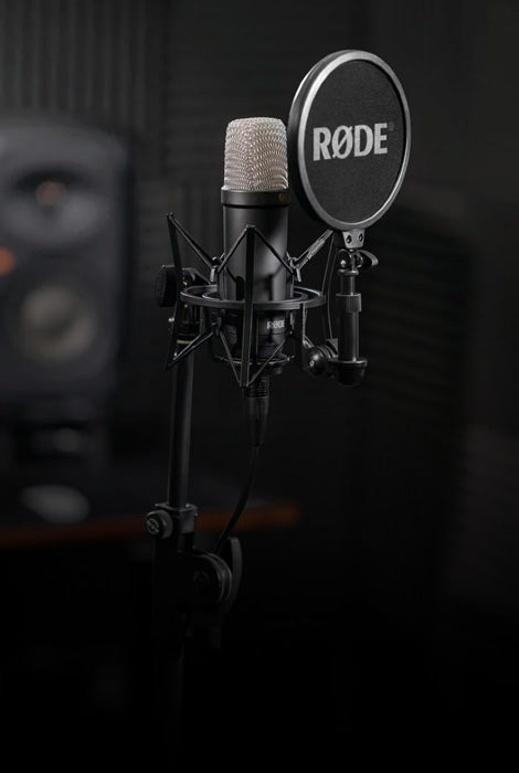 Rode microphone with pop filter on a dark background