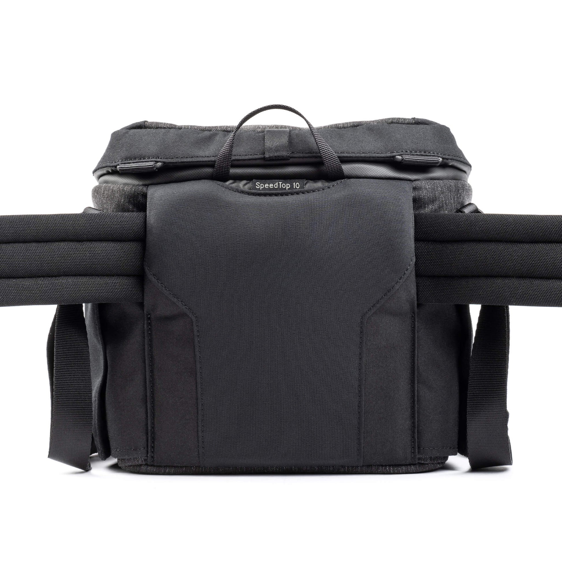Think Tank SpeedTop 10 — compact crossbody camera bag with magnetic top lid and adjustable strap.
