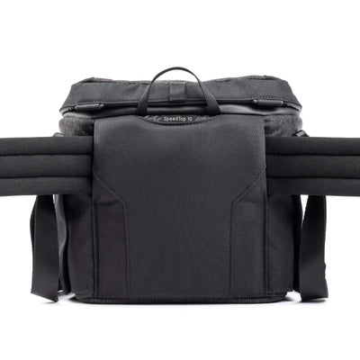Think Tank SpeedTop 10 — compact crossbody camera bag with magnetic top lid and adjustable strap.