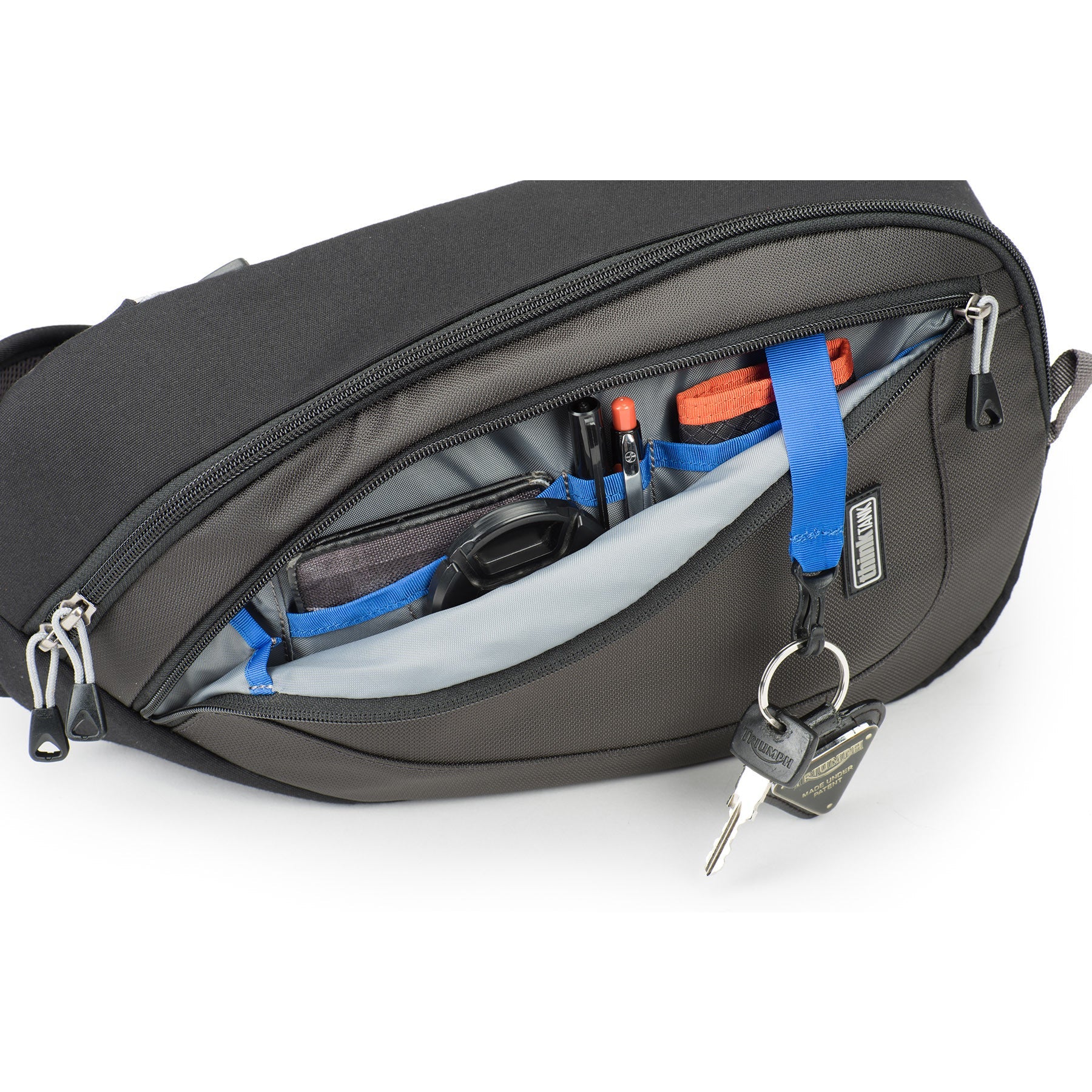 Think Tank TurnStyle 20 V2 sling bag — charcoal camera bag with contoured shoulder strap and side-rotation access for gear