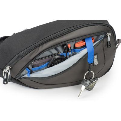 Think Tank TurnStyle 20 V2 sling bag — charcoal camera bag with contoured shoulder strap and side-rotation access for gear