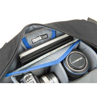 Think Tank TurnStyle 20 V2 sling bag — charcoal camera bag with contoured shoulder strap and side-rotation access for gear