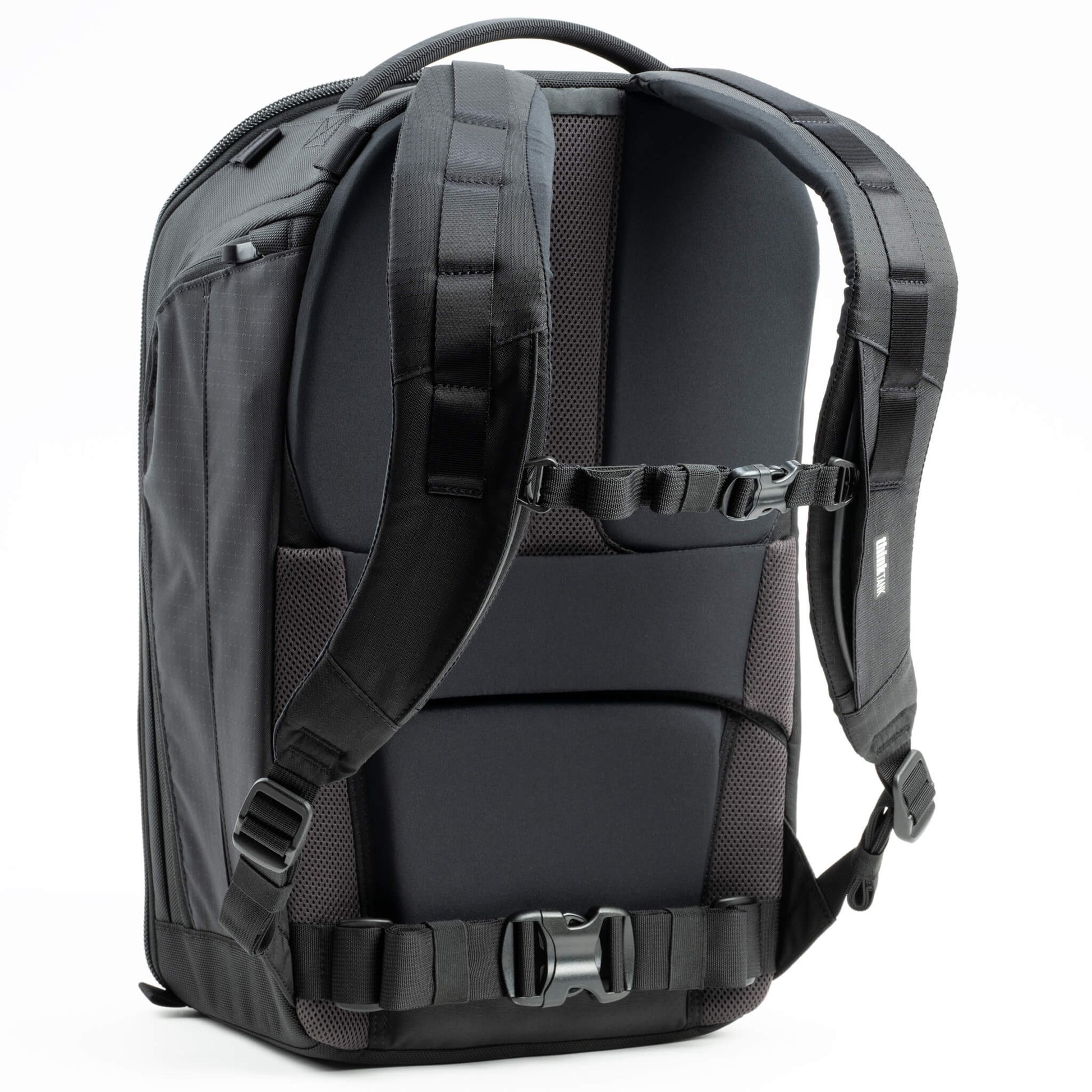 Think Tank Walker Pro backpack — rugged, roll-top camera pack in charcoal grey with side access pockets