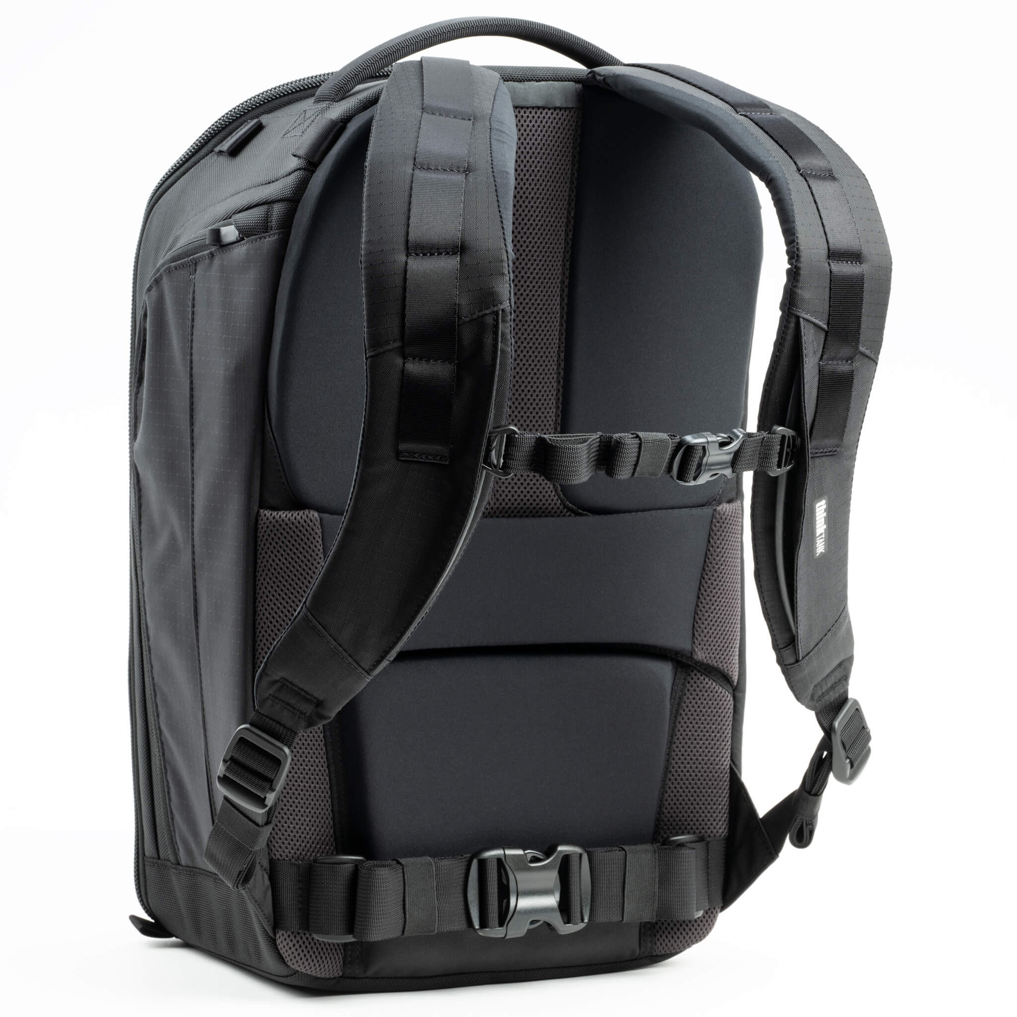 Think Tank Walker Pro backpack — rugged, roll-top camera pack in charcoal grey with side access pockets