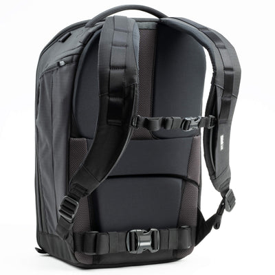 Think Tank Walker Pro backpack — rugged, roll-top camera pack in charcoal grey with side access pockets