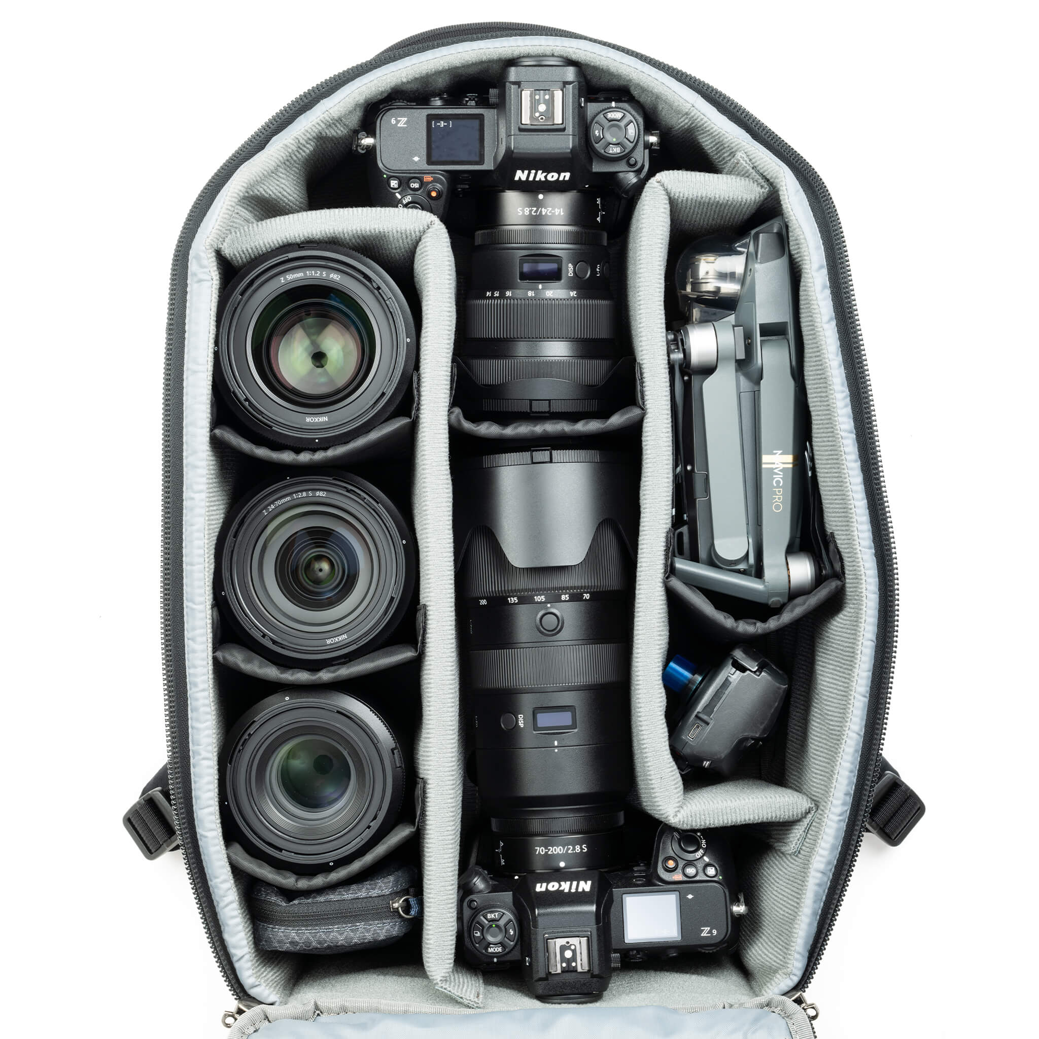 Think Tank Walker Pro backpack — rugged, roll-top camera pack in charcoal grey with side access pockets