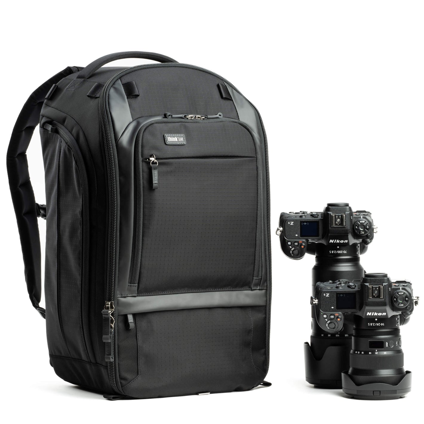 Think Tank Walker Pro backpack — rugged, roll-top camera pack in charcoal grey with side access pockets