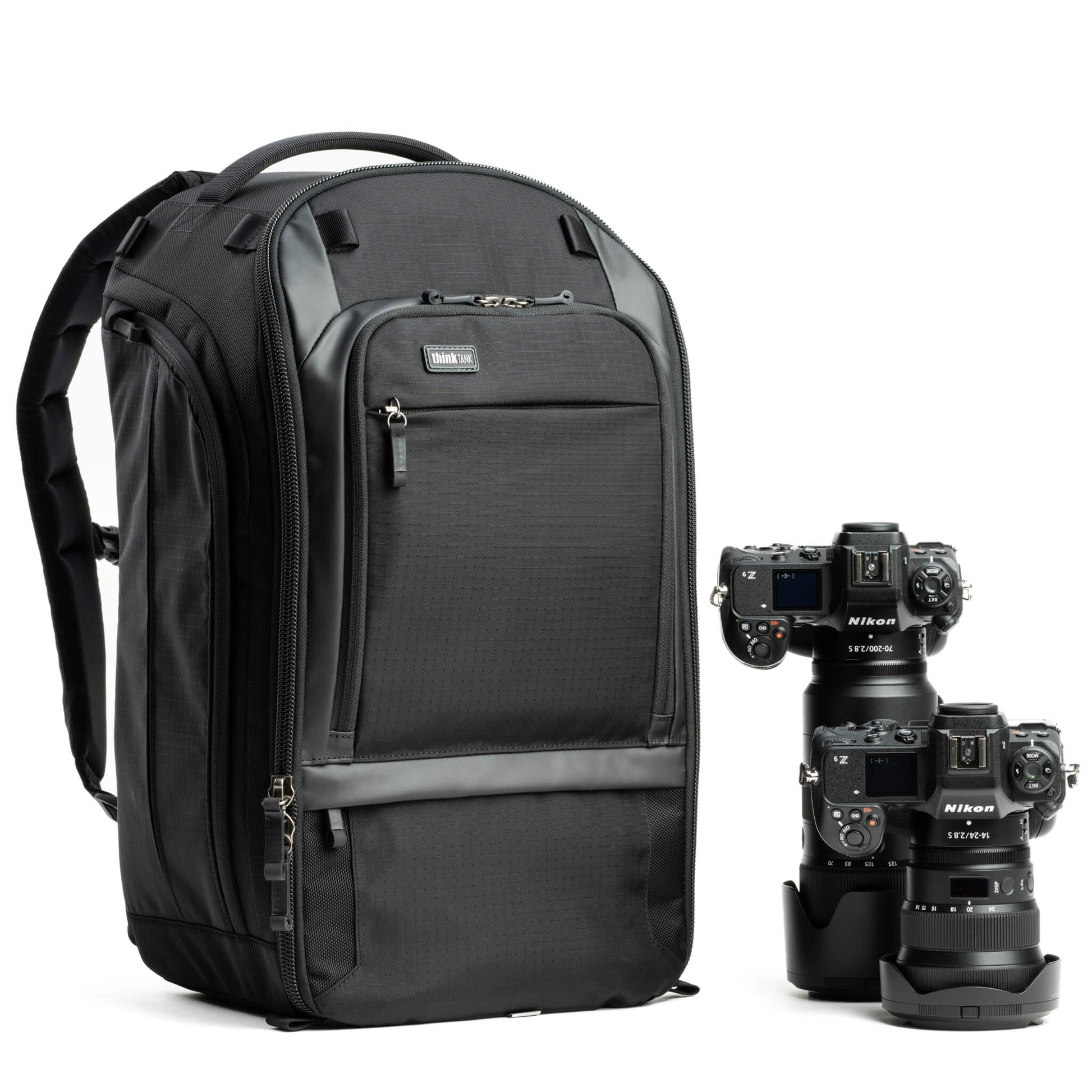 Think Tank Walker Pro backpack — rugged, roll-top camera pack in charcoal grey with side access pockets