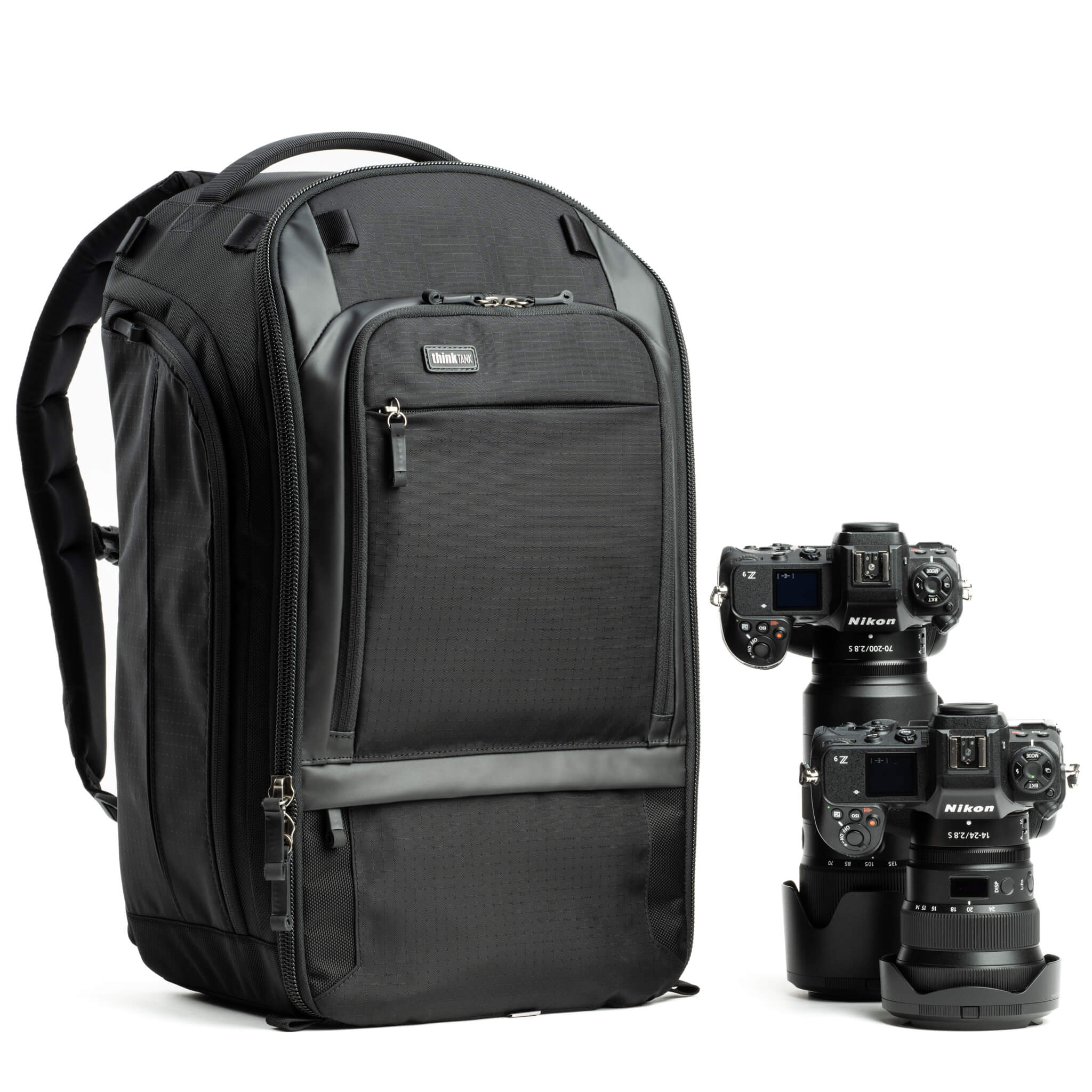 Think Tank Walker Pro backpack — rugged, roll-top camera pack in charcoal grey with side access pockets