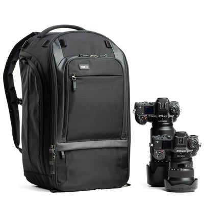 Think Tank Walker Pro backpack — rugged, roll-top camera pack in charcoal grey with side access pockets