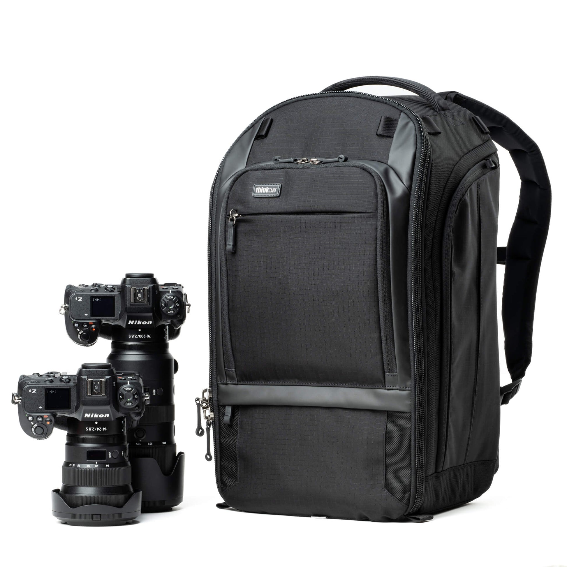 Think Tank Walker Pro backpack — rugged, roll-top camera pack in charcoal grey with side access pockets