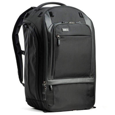Think Tank Walker Pro backpack — rugged, roll-top camera pack in charcoal grey with side access pockets