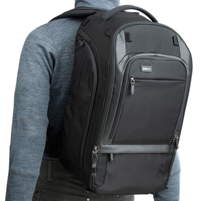 Think Tank Walker Pro backpack — rugged, roll-top camera pack in charcoal grey with side access pockets
