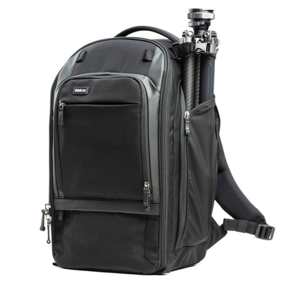Think Tank Walker Pro backpack — rugged, roll-top camera pack in charcoal grey with side access pockets