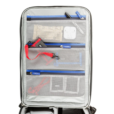 Think Tank Airport Accelerator camera backpack — black, large roll-top pack with padded dividers and side tripod mounts
