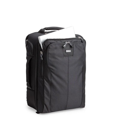 Think Tank Airport Accelerator camera backpack — black, large roll-top pack with padded dividers and side tripod mounts