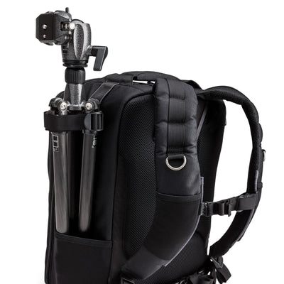 Think Tank Airport Commuter camera backpack — black carry-on bag with padded camera compartment, laptop sleeve, and side tripod straps.