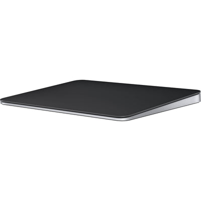 A sleek, black Apple Magic Trackpad with a large edge-to-edge glass surface and a low-profile ergonomic tilt, shown from a three-quarter perspective.
