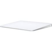 A sleek, white Apple Magic Trackpad with a large edge-to-edge glass surface and a low-profile ergonomic tilt, shown from a three-quarter perspective.
