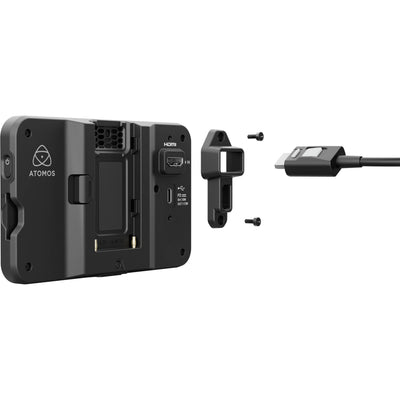 Display device with a screen showing a person on a skateboard, branded 'Atomos', on a light gray background
