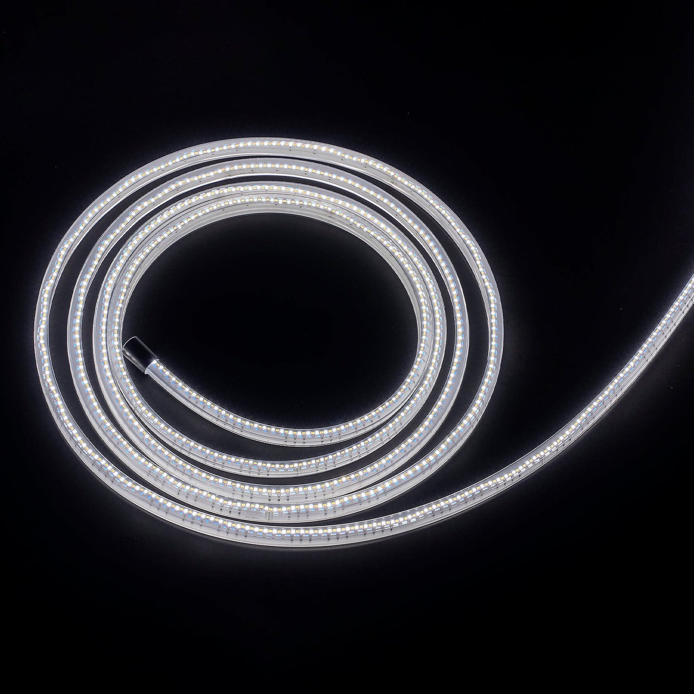 Coiled LED light strip on a black background