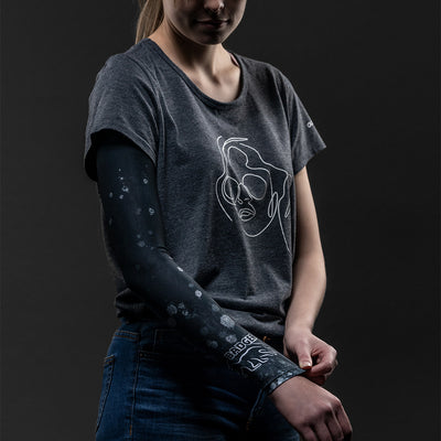 A stay-up arm sleeve in black that will cover and protect your arm from harmful sun rays and provide an extra warming layer of protection in colder weather.