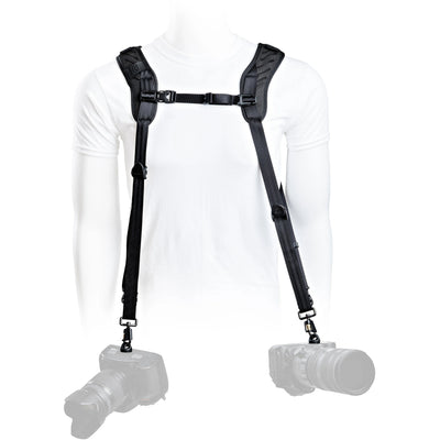 Camera shoulder harness with two camera bodies on a white background