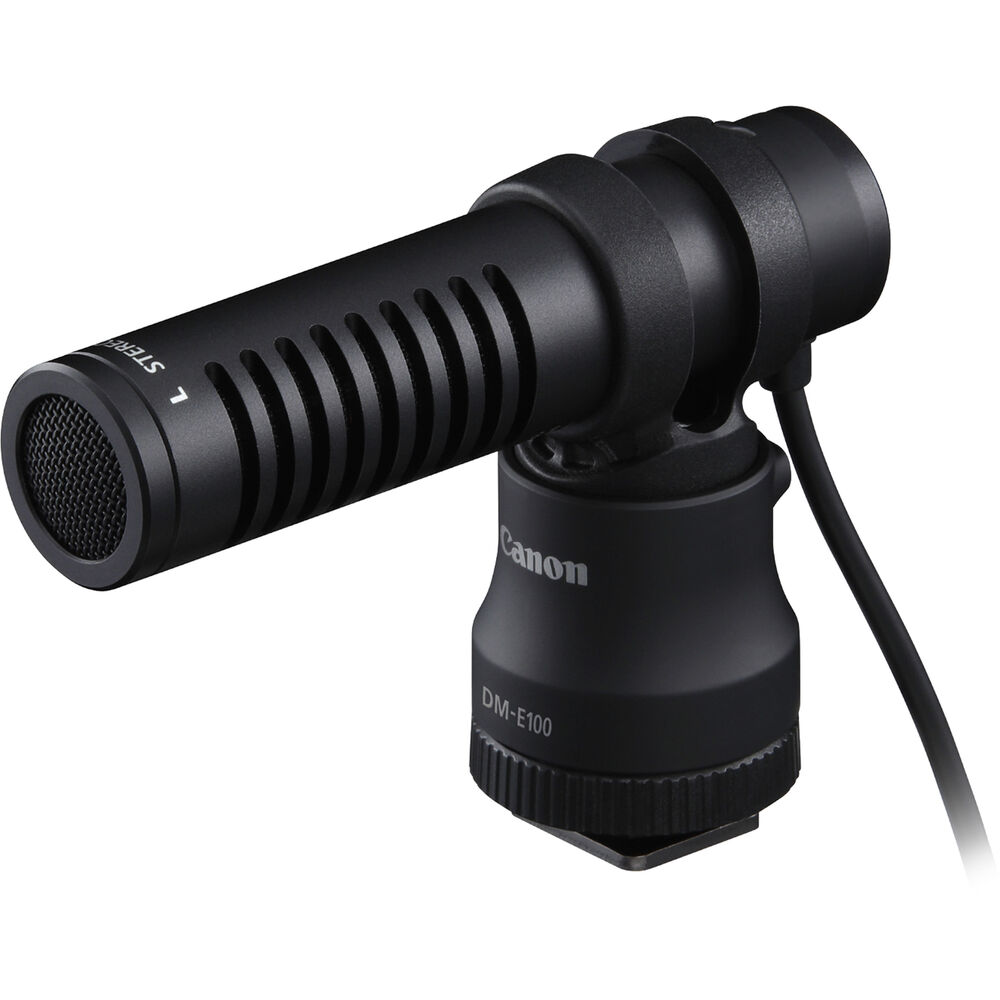 Canon EOS R50 Creator Kit with camera, mic, tripod grip, and 18-45mm lens.
