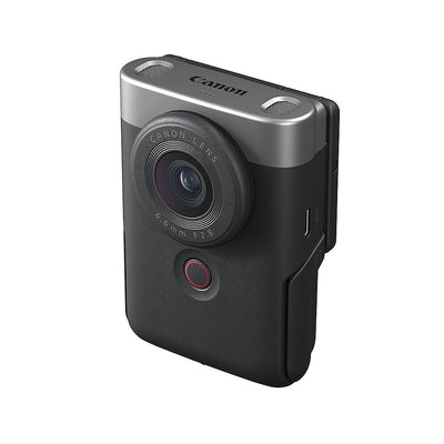 Canon PowerShot V10 Advanced Vlogging Kit (Silver): Compact 15MP 1" BSI CMOS sensor, fixed 19mm wide-angle lens, UHD 4K30p and Full HD 60p video, dual built-in stereo mics with wind filter, enhanced image stabilization, 2" tilting touchscreen, built-in stand, Wi-Fi & Bluetooth, camera cage kit included for accessory mounting and wind noise reduction.