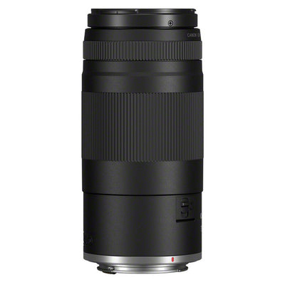 Black camera lens on a white background